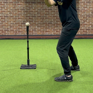 A baseball player practices adjusting his body rotation