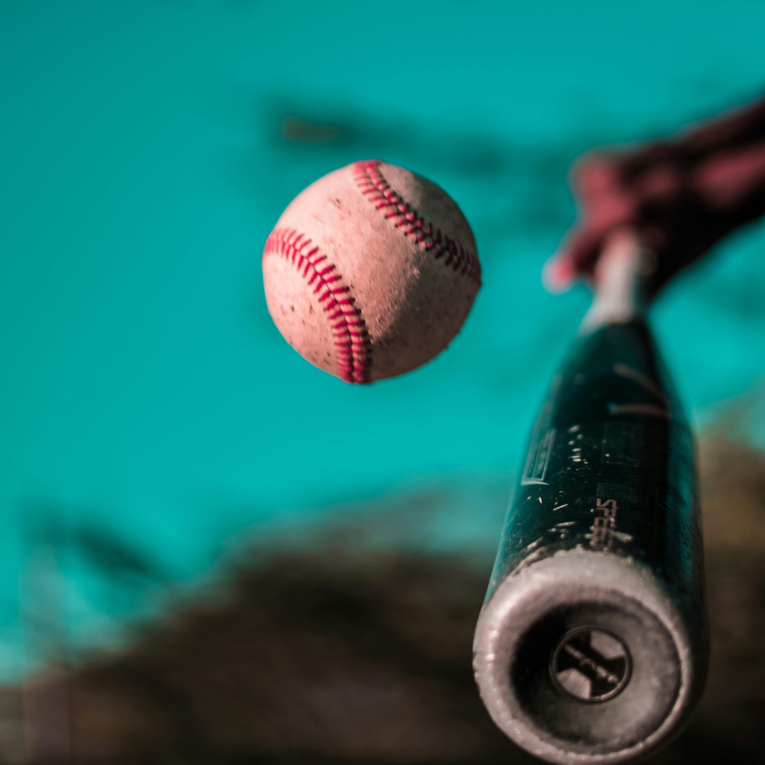 The moment when the bat makes contact with the ball.