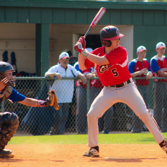 Batter keeping his eye on the ball and waiting to swing