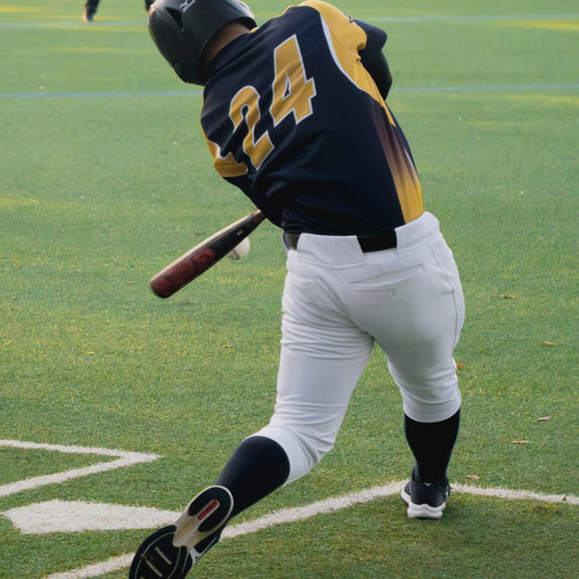 Baseball player making contact with the ball
